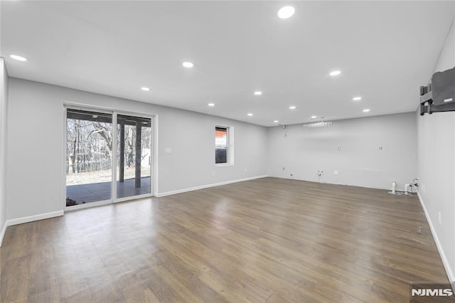 unfurnished living room featuring hardwood / wood-style floors