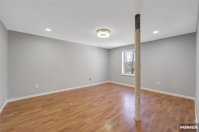 unfurnished room with light wood-type flooring