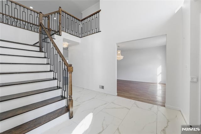 stairway with a towering ceiling