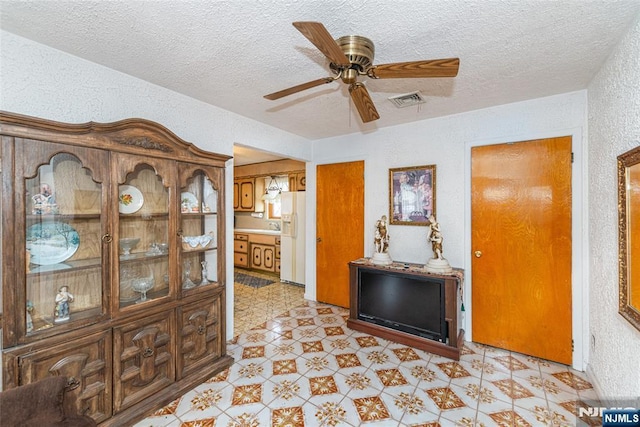 hallway with a textured ceiling