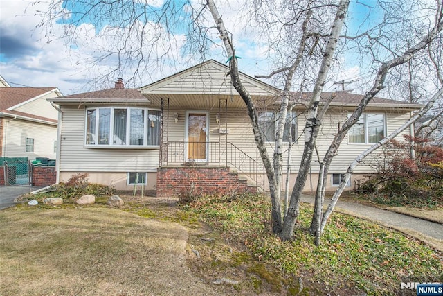 view of front of home with a front lawn