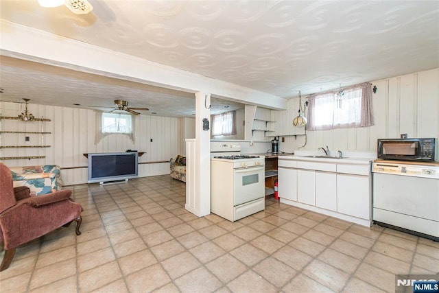 kitchen featuring ceiling fan, sink, white cabinets, and white appliances