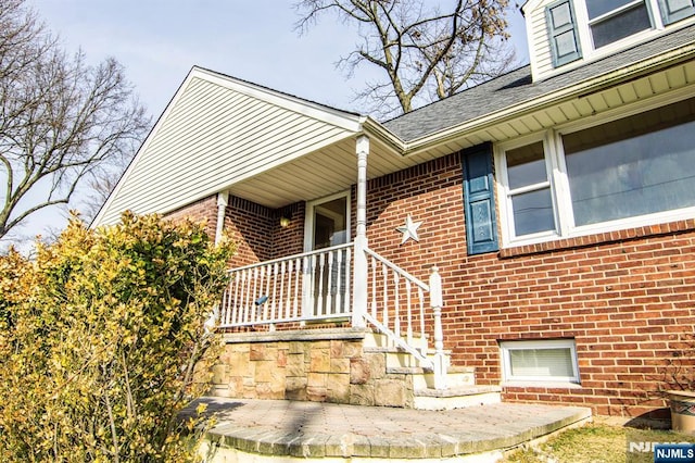 exterior space with brick siding