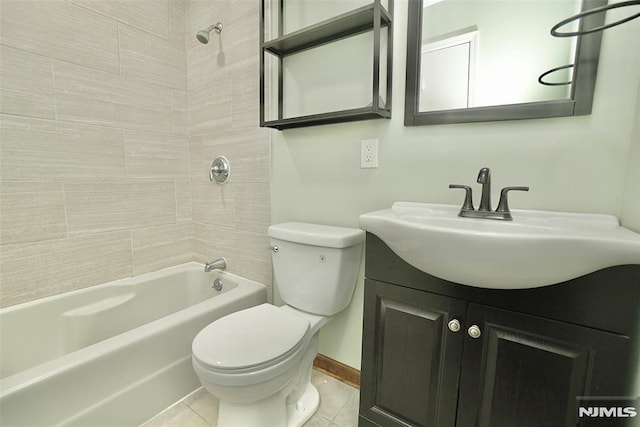 full bathroom with tile patterned floors, vanity, toilet, and tiled shower / bath