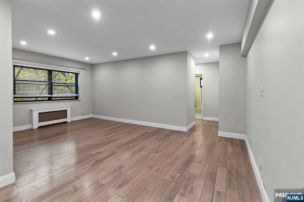 unfurnished living room featuring light wood-type flooring