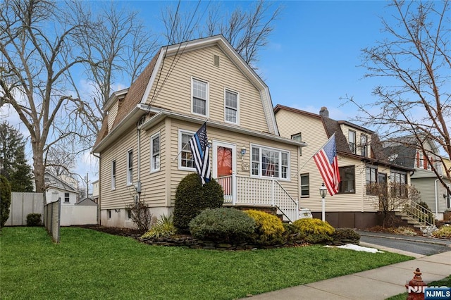 view of property with a front lawn