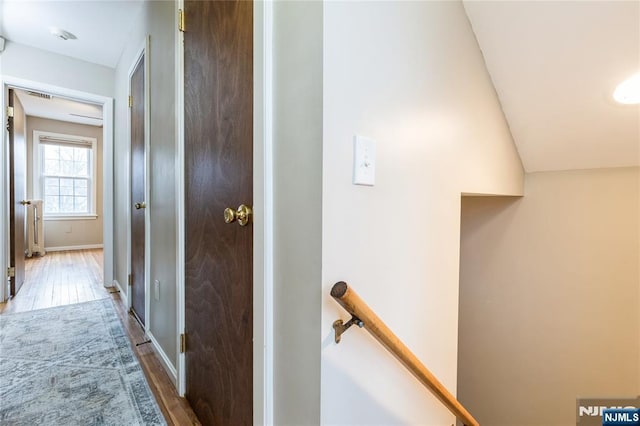 hallway featuring wood-type flooring