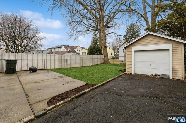 garage with a yard