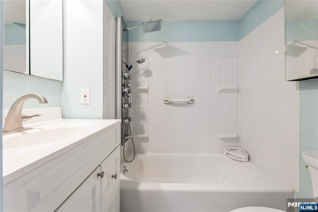 full bathroom featuring vanity, shower / bathtub combination, and toilet