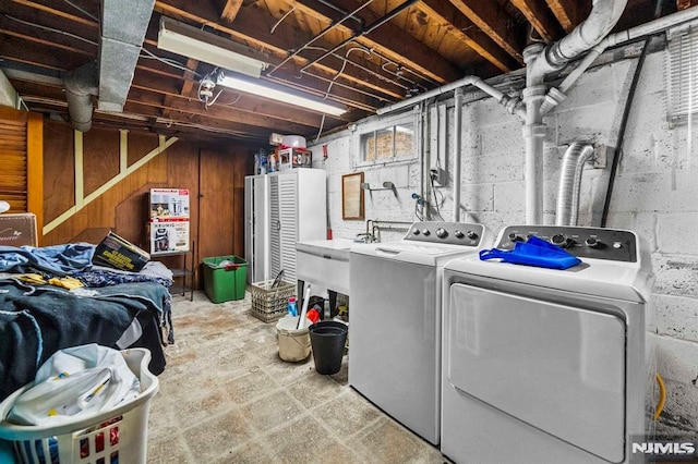 washroom featuring sink and independent washer and dryer