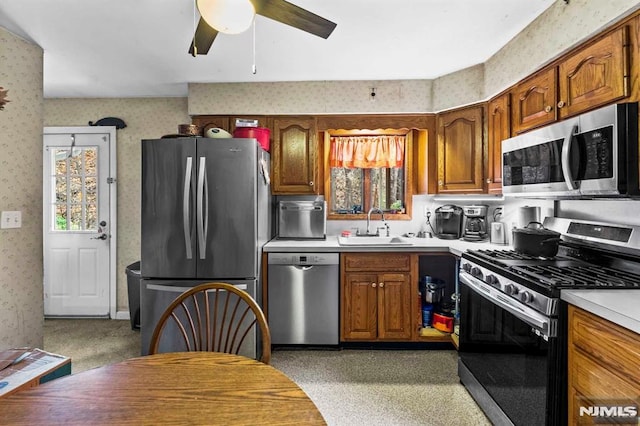 kitchen with sink, stainless steel appliances, and ceiling fan