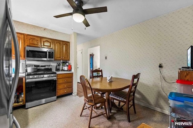 kitchen featuring ceiling fan and appliances with stainless steel finishes