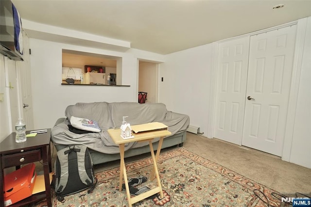 living room with carpet floors and baseboard heating