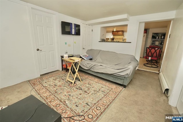 carpeted living room featuring baseboard heating