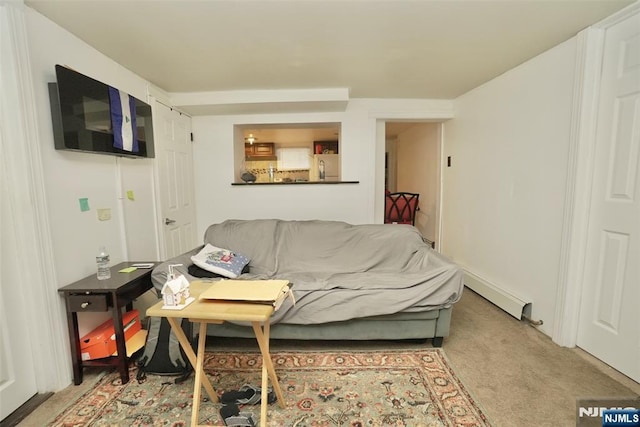 living room featuring baseboard heating and light colored carpet