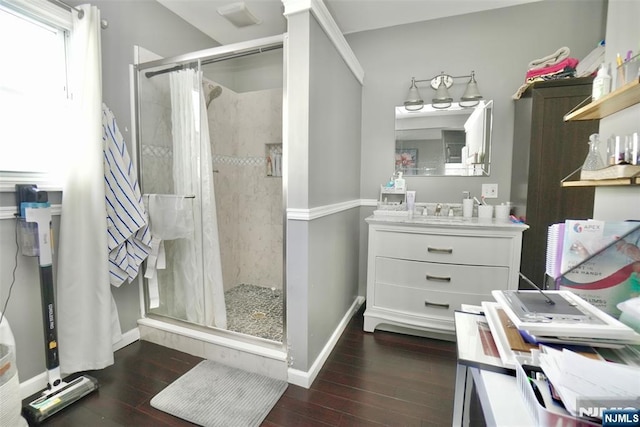 bathroom with vanity, a shower with shower curtain, and hardwood / wood-style floors