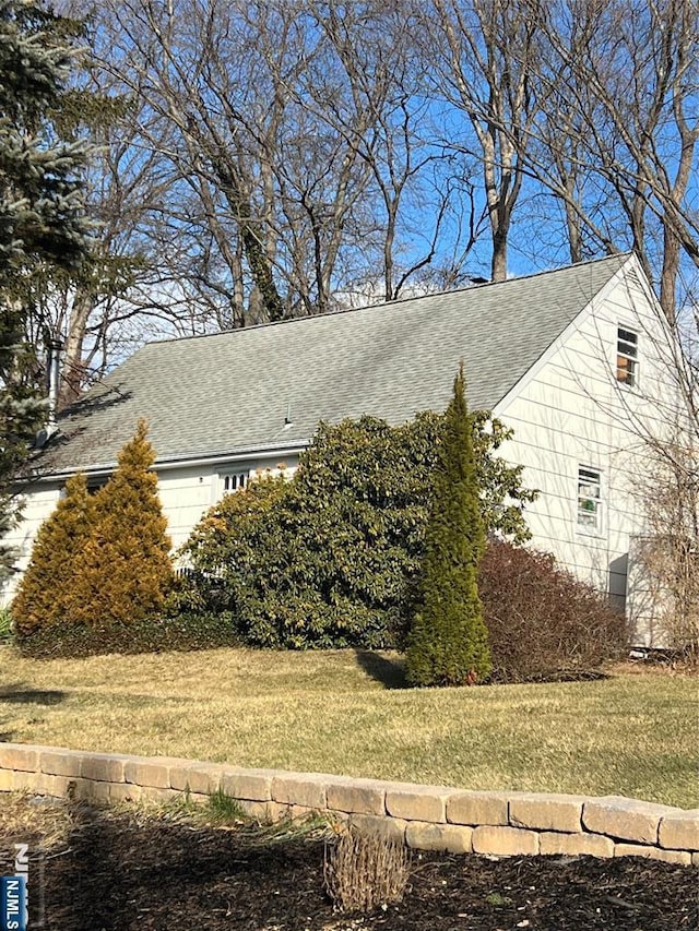 view of home's exterior with a yard