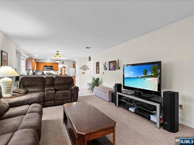 living room featuring light carpet