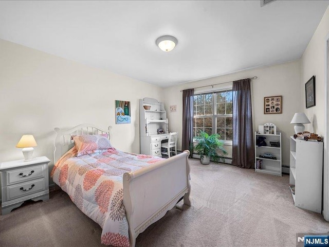 bedroom featuring light carpet