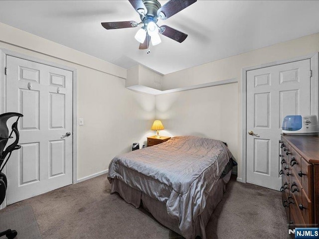 carpeted bedroom with ceiling fan