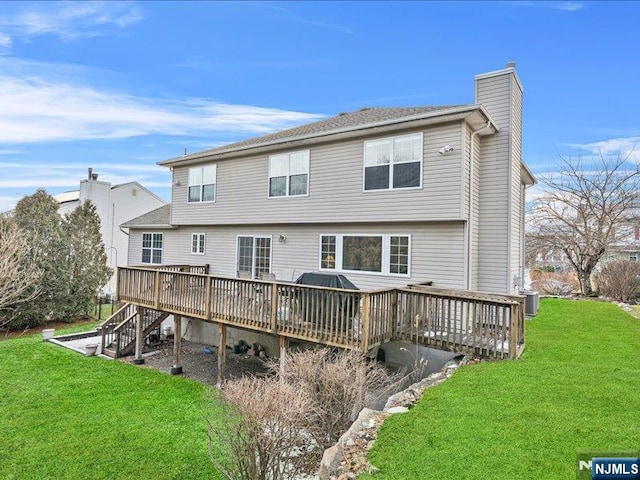 back of property featuring central AC, a lawn, and a deck