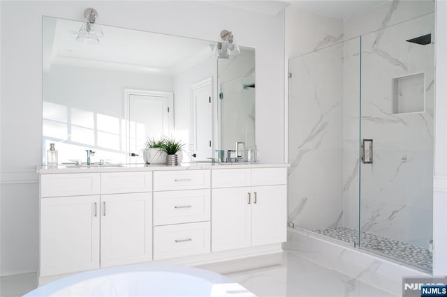 bathroom featuring vanity and an enclosed shower