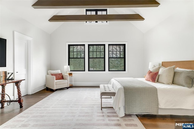 bedroom with beamed ceiling, high vaulted ceiling, and hardwood / wood-style floors