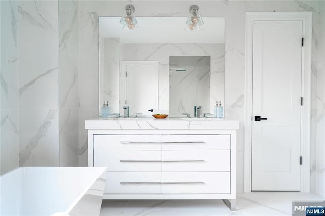 bathroom featuring vanity and shower with separate bathtub