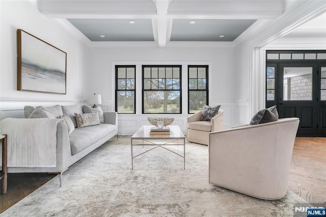 living room featuring coffered ceiling, parquet flooring, plenty of natural light, and beam ceiling