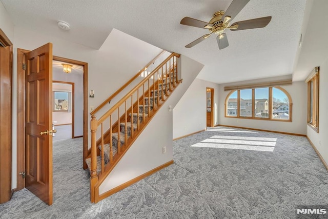 living room with light carpet and a textured ceiling