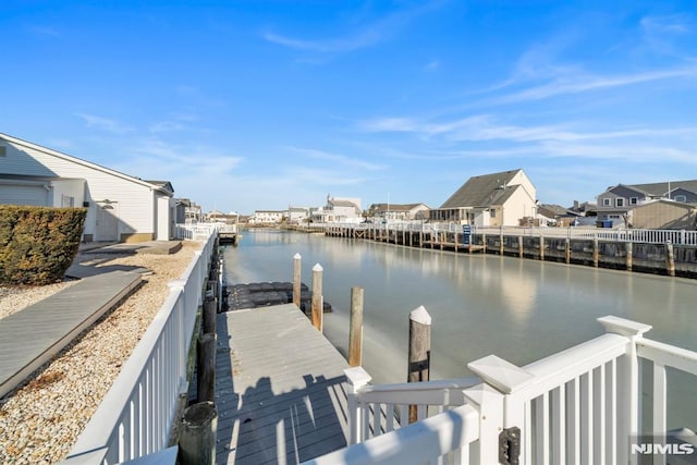 dock area featuring a water view