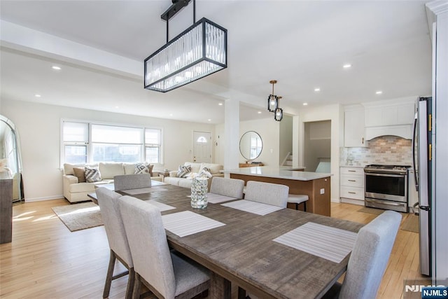 dining area with light hardwood / wood-style floors