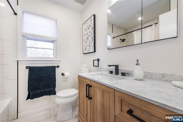 bathroom with vanity and toilet