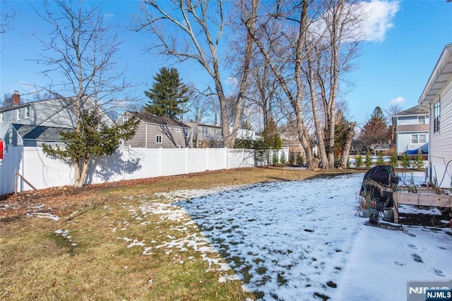 view of yard covered in snow