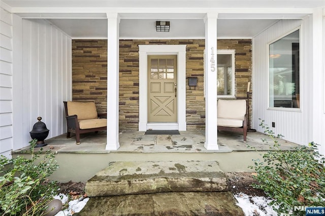 doorway to property with covered porch