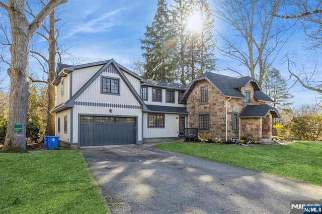 view of front of home with a garage and a front yard