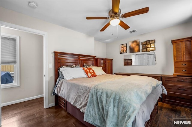 bedroom featuring dark hardwood / wood-style floors and ceiling fan