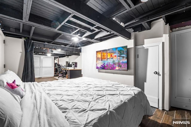 bedroom featuring dark wood-type flooring