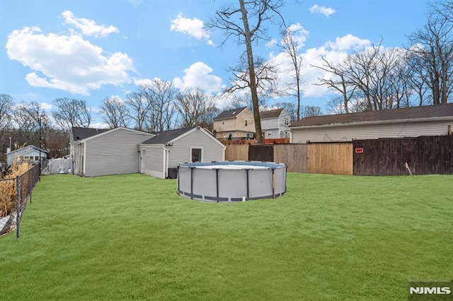 view of yard featuring a fenced in pool