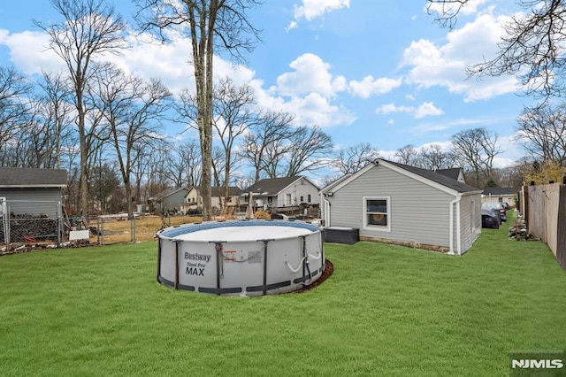 view of yard featuring a fenced in pool