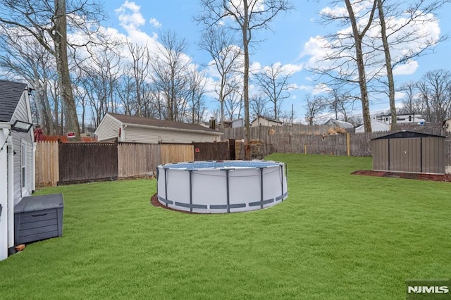 view of yard with a fenced in pool