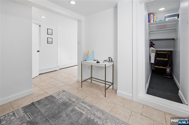 corridor with light tile patterned flooring