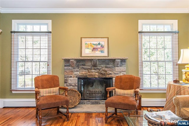 sitting room featuring ornamental molding and a healthy amount of sunlight