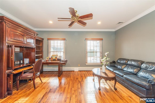 office space featuring crown molding, ceiling fan, and light hardwood / wood-style floors