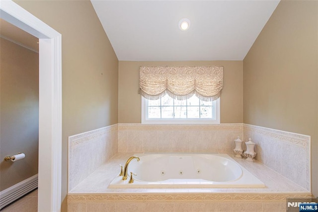 bathroom featuring tiled bath