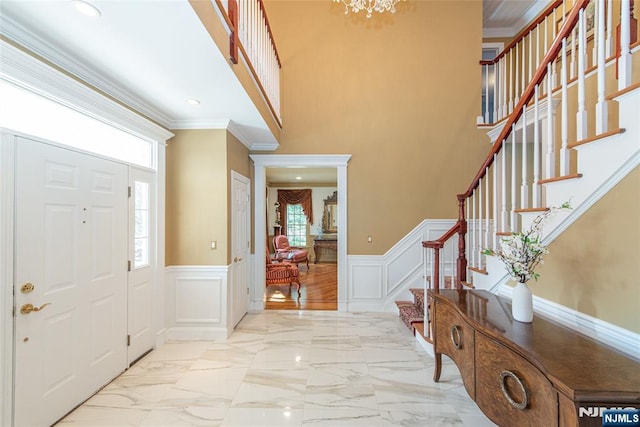 entrance foyer featuring crown molding