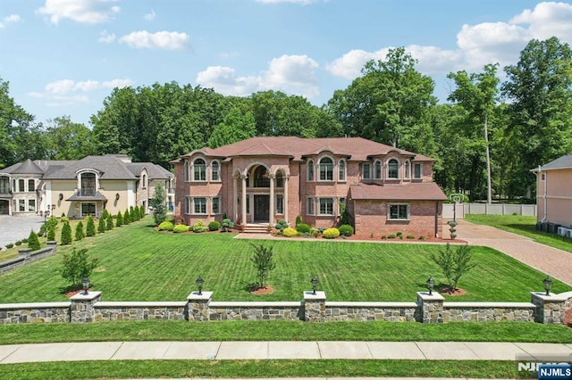 mediterranean / spanish house featuring a front yard