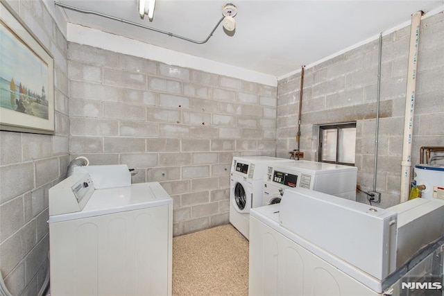 clothes washing area with independent washer and dryer