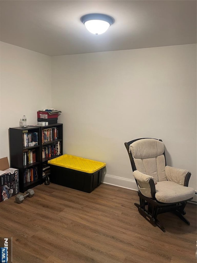 sitting room featuring dark hardwood / wood-style floors