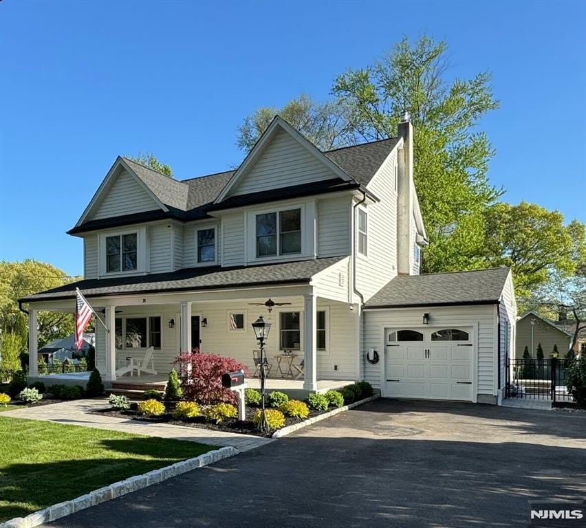 view of front of house with a garage and covered porch